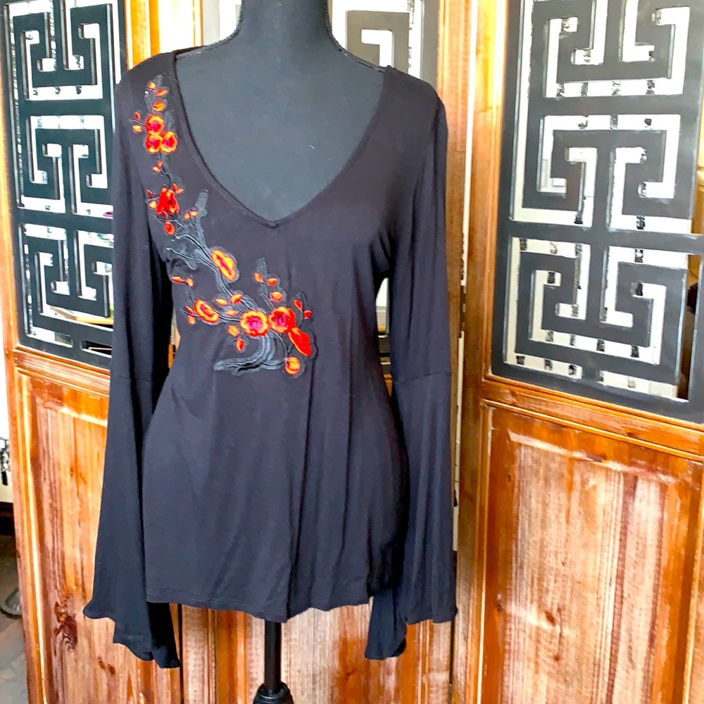 Black top with embroidered floral detail